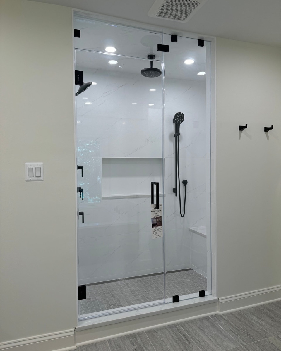 Jetty Series style minimal fixed glass panels on a walk-in shower in Maryland